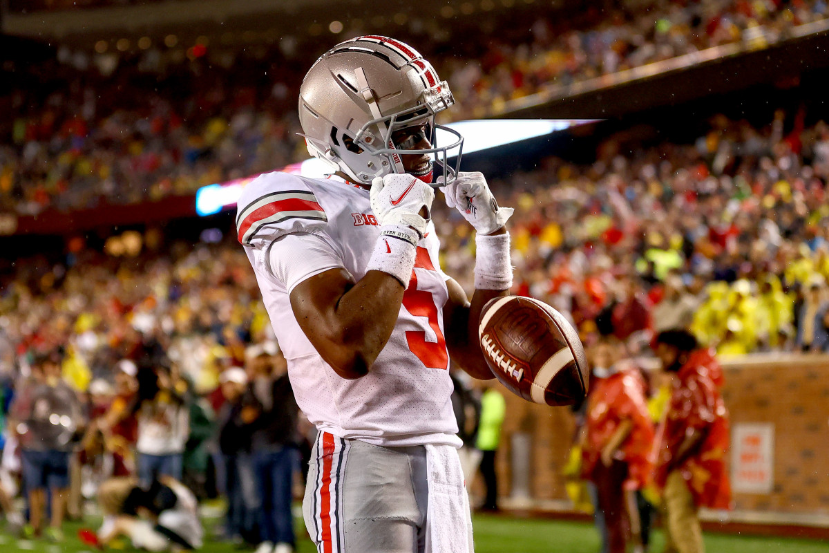 Garrett Wilson (5) celebrates after scoring a touchdown during the third quarter against the Minnesota Gophers at Huntington Bank Stadium.